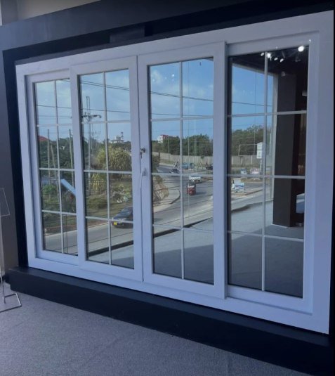 White four-panel window with grid bars on display