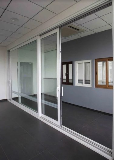 Large white sliding doors in an office space