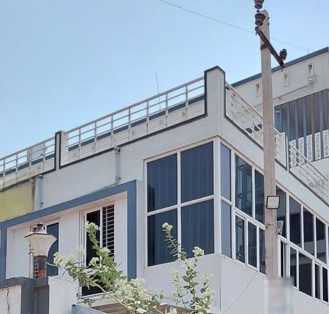 Upper floor of a house with UPVC windows wrapping around the corner